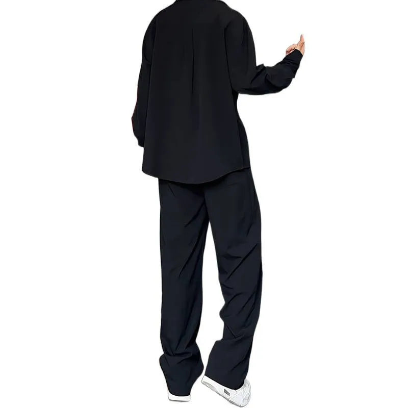 Men's black casual two-piece suit with long sleeve polo shirt and matching trousers