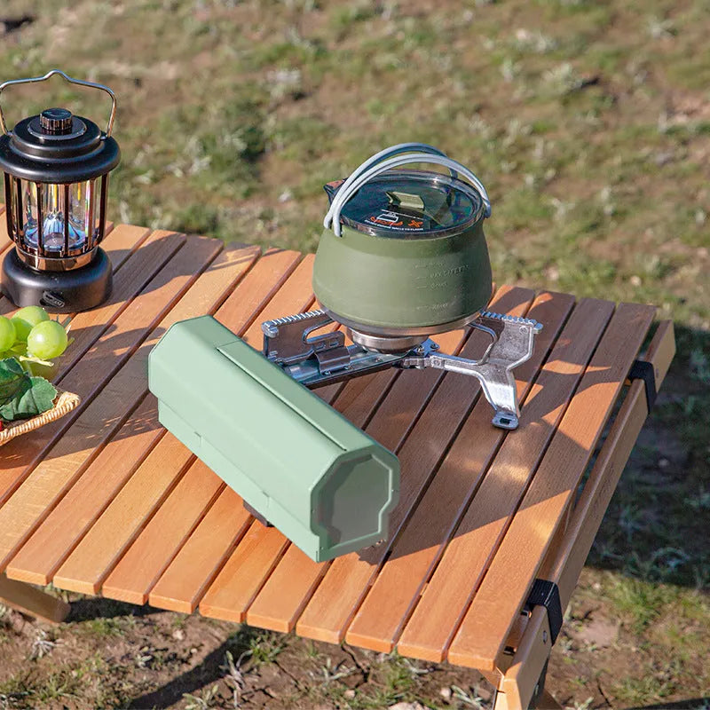Portable folding camping gas stove with 2.6 kW burner and carry bag in green
