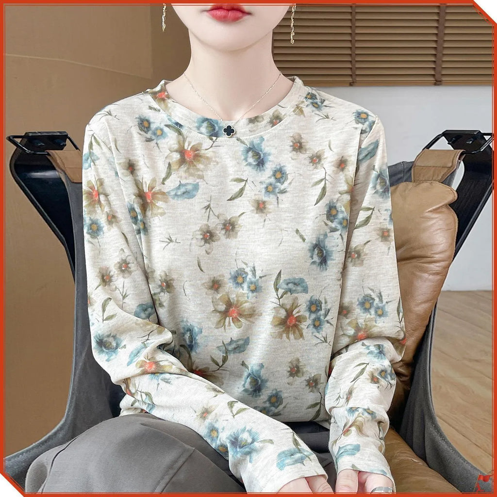 Women's round neck floral print pullover top in Tencel cotton fabric on a hanger.