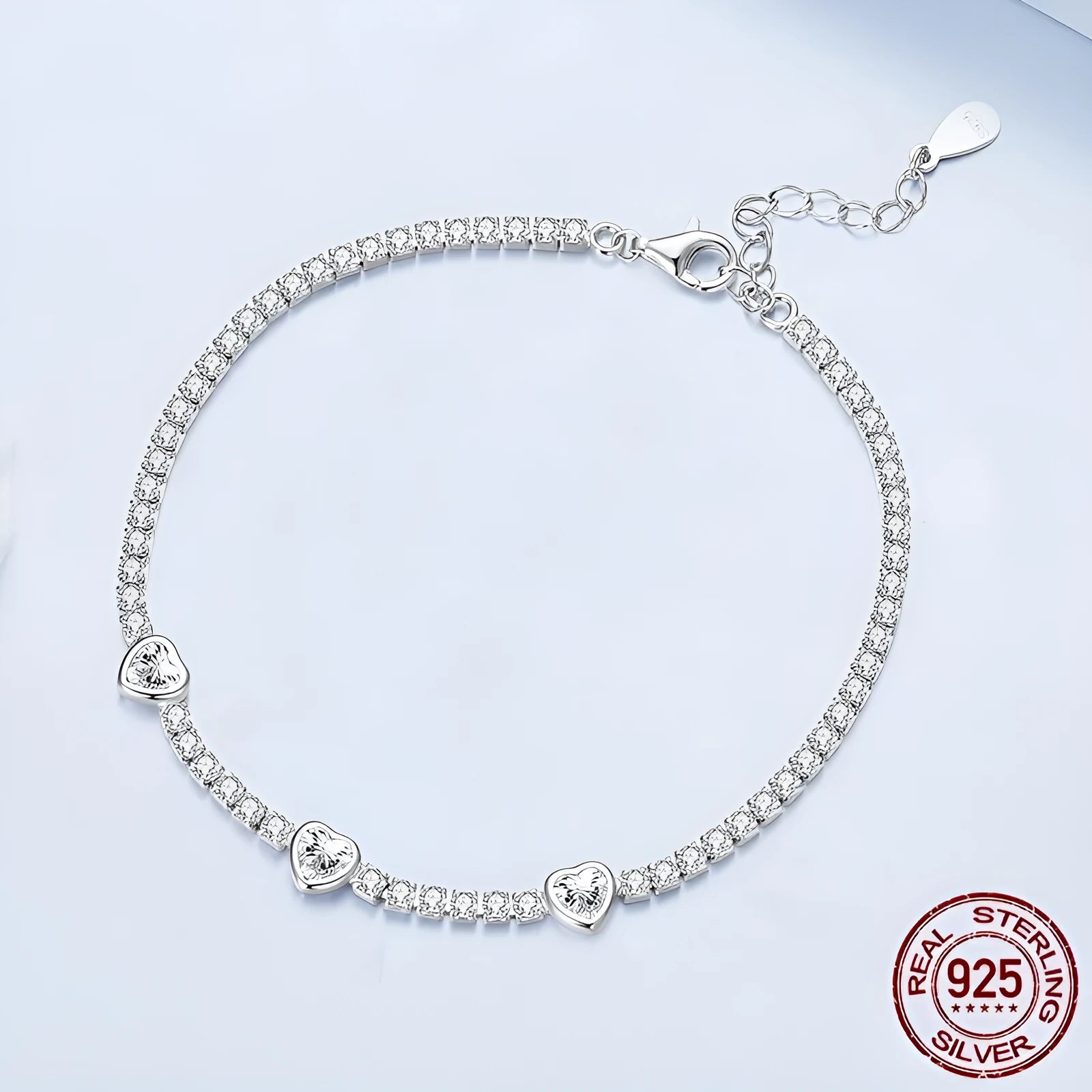 S925 sterling silver bracelet with heart-shaped clear zircon centrepiece on light background