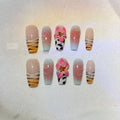 Lily hand carving acrylic nail art set featuring black and white zebra stripes with raised pink floral embossments.