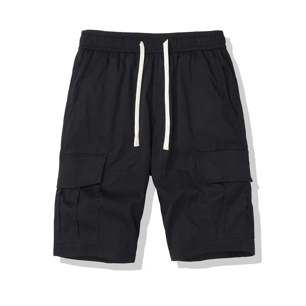Men's multi-pocket loose cropped pants in black, side view showing multiple pockets and loose fit