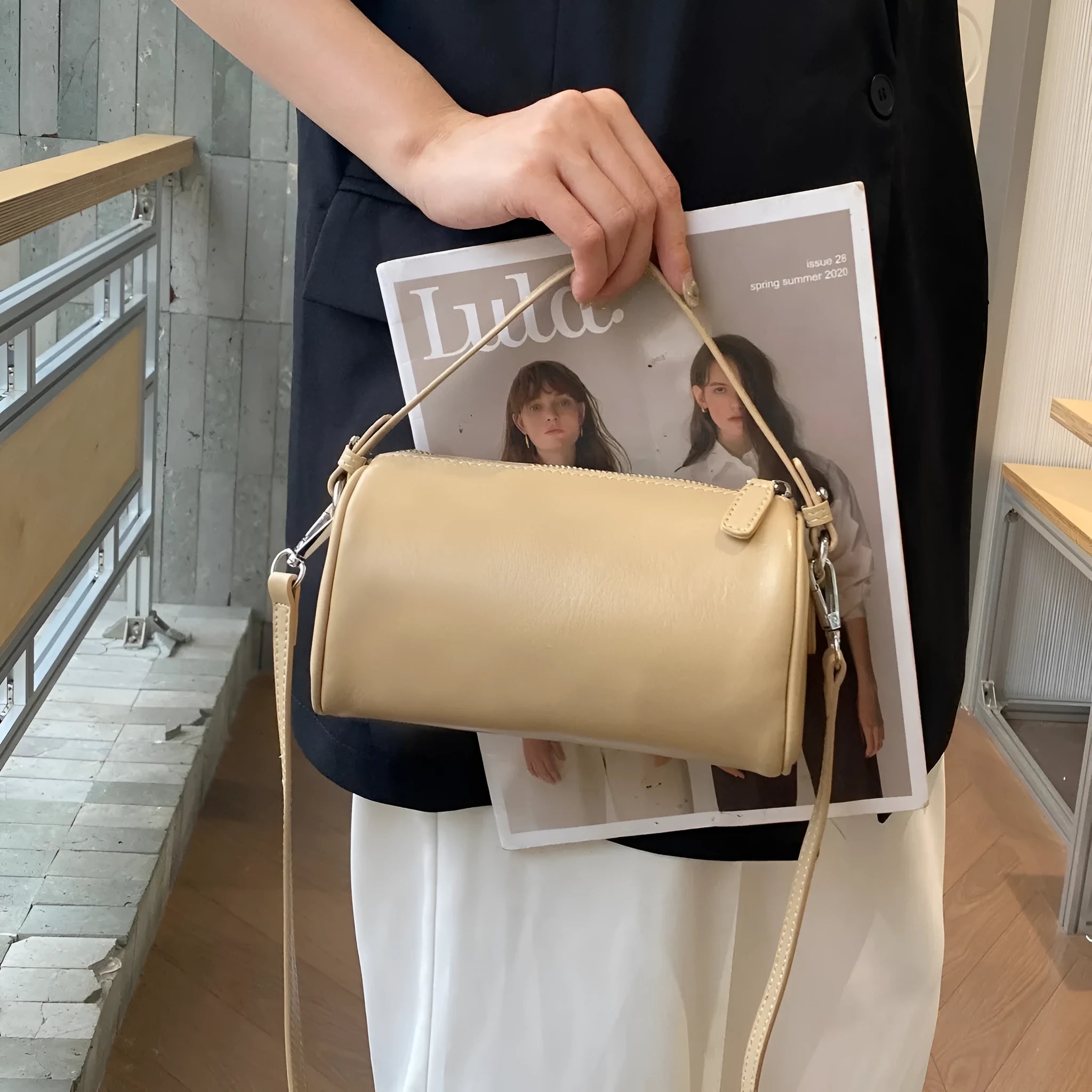 Genuine leather cylindrical crossbody phone bag in multiple colours with an adjustable strap.