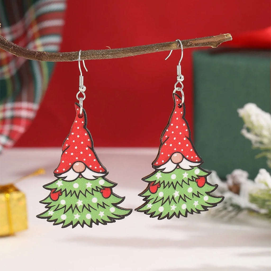 Women's wooden Christmas earrings with printed tree and snowman designs on geometric shapes.