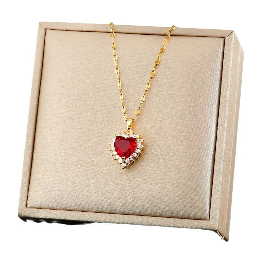 Women's heart pendant necklace set with floral gemstone inlay and matching earrings ring in gold-red titanium steel