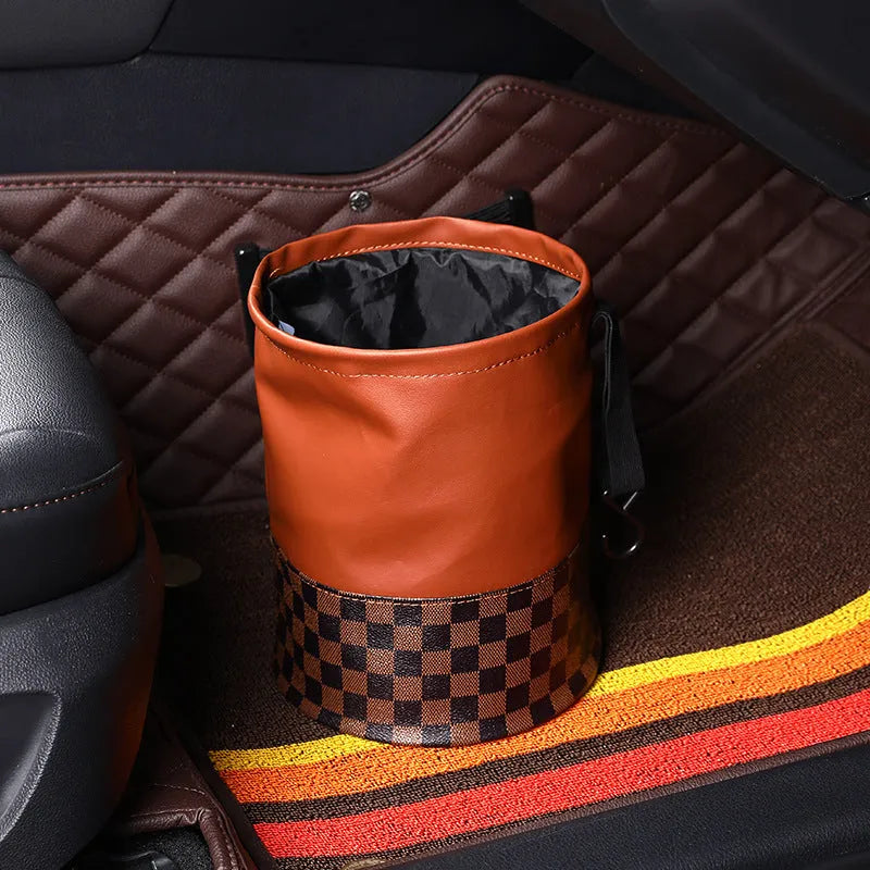 Brown leather retractable car rubbish bin with handle in expanded position