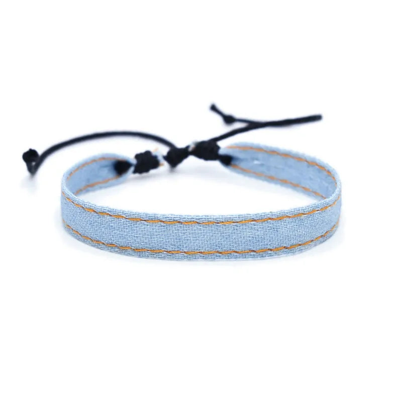 Handmade denim fabric unisex bracelet carrying strap in a cute style for travel.