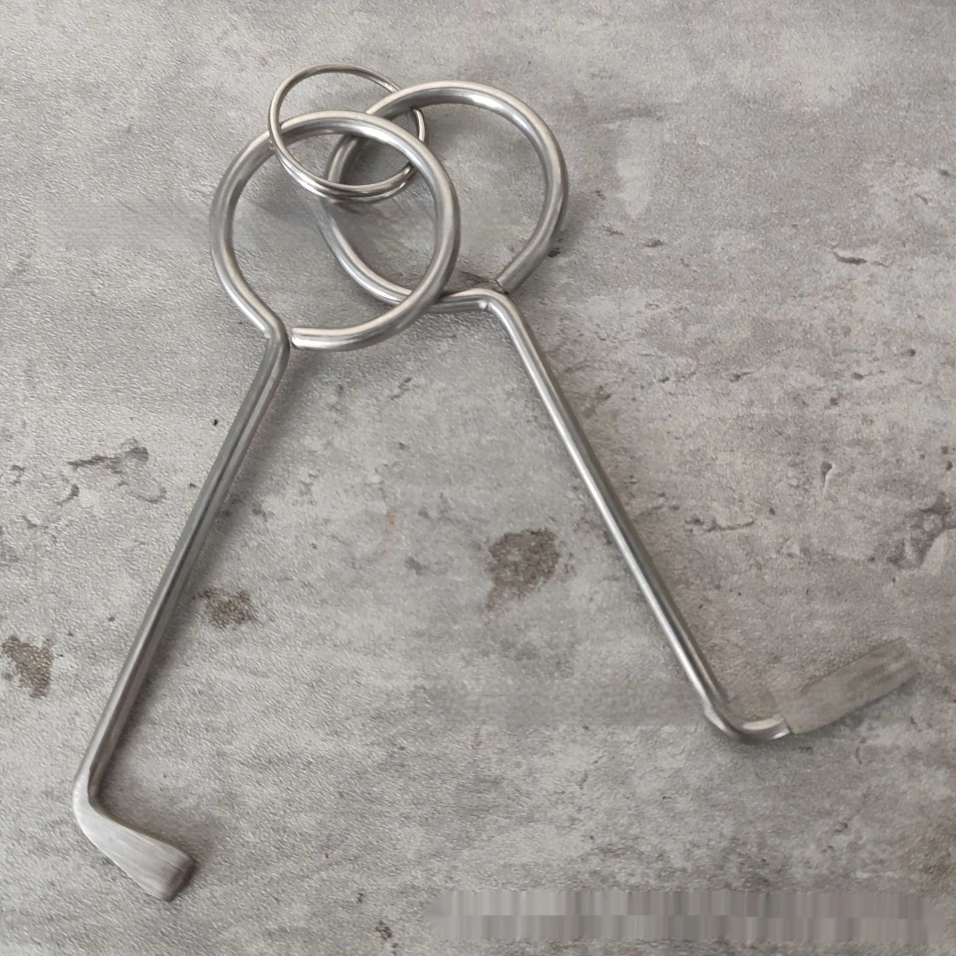 Two silver alloy wrench tools from a portable DIY and maintenance tool set.