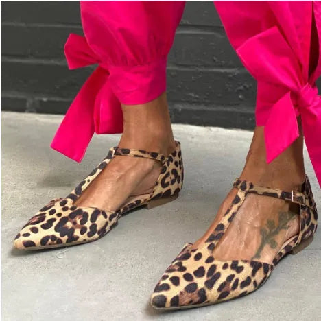 Leopard print women's pumps with pointed toe, chunky low heel, and ankle cross strap.