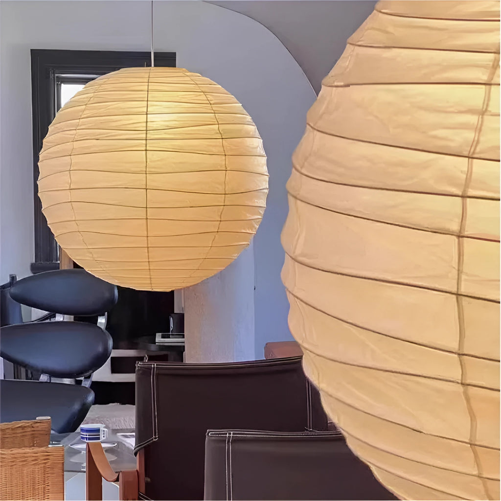 Japanese style rice paper pendant chandelier hanging from a ceiling, providing soft ambient light.