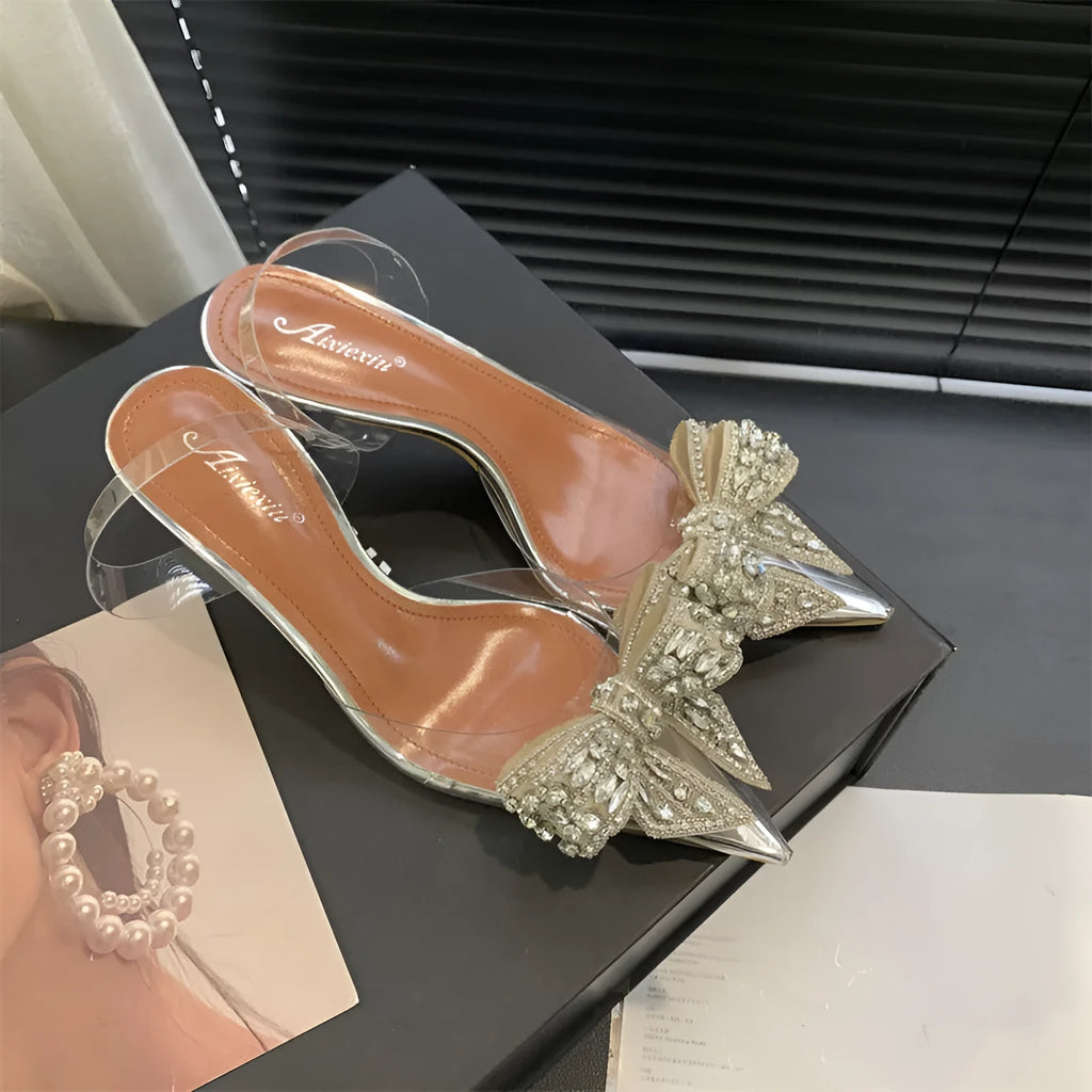 Silver bow rhinestone pointed transparent slip-on high heel sandals with 6-8cm heel and rubber outsole