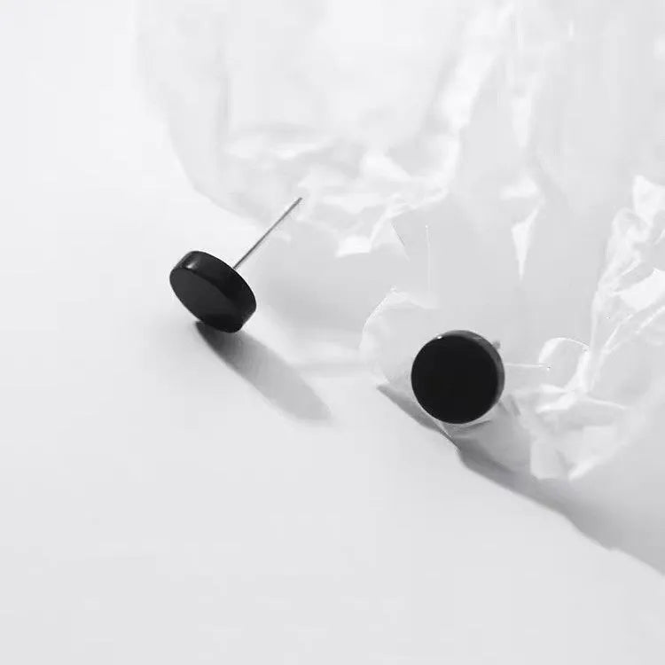 S999 sterling silver ear bone studs in silver and black colours with round geometric shape