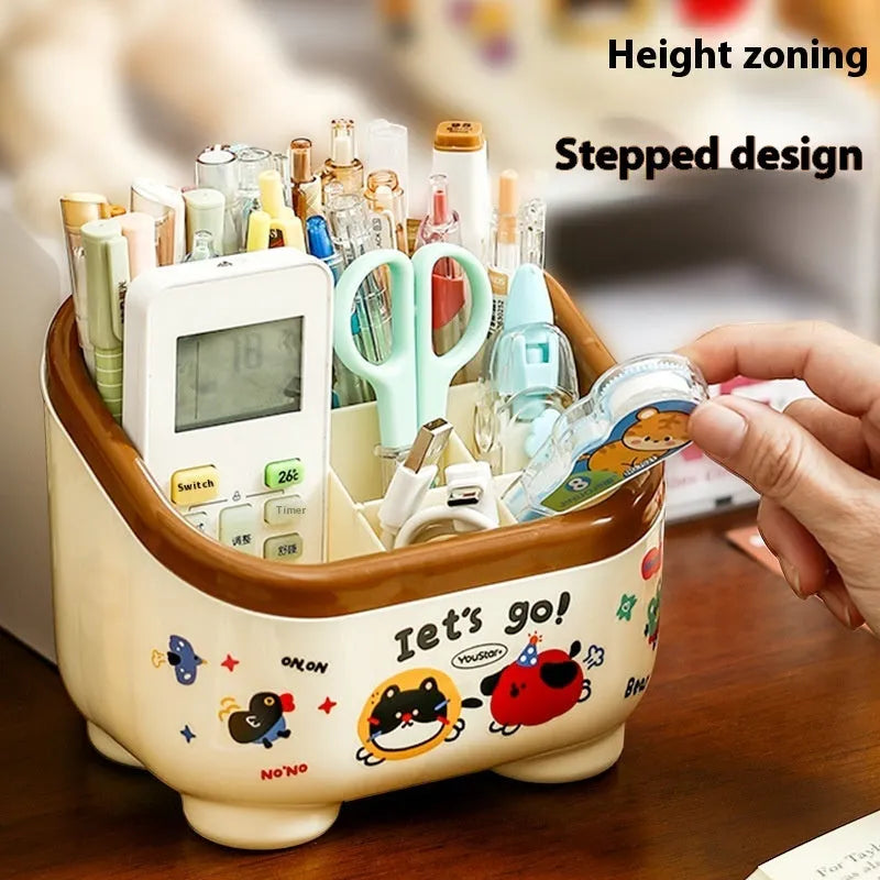 Cartoon-style plastic desktop organiser set with multiple boxes, pen holder, and 2L capacity on a desk.