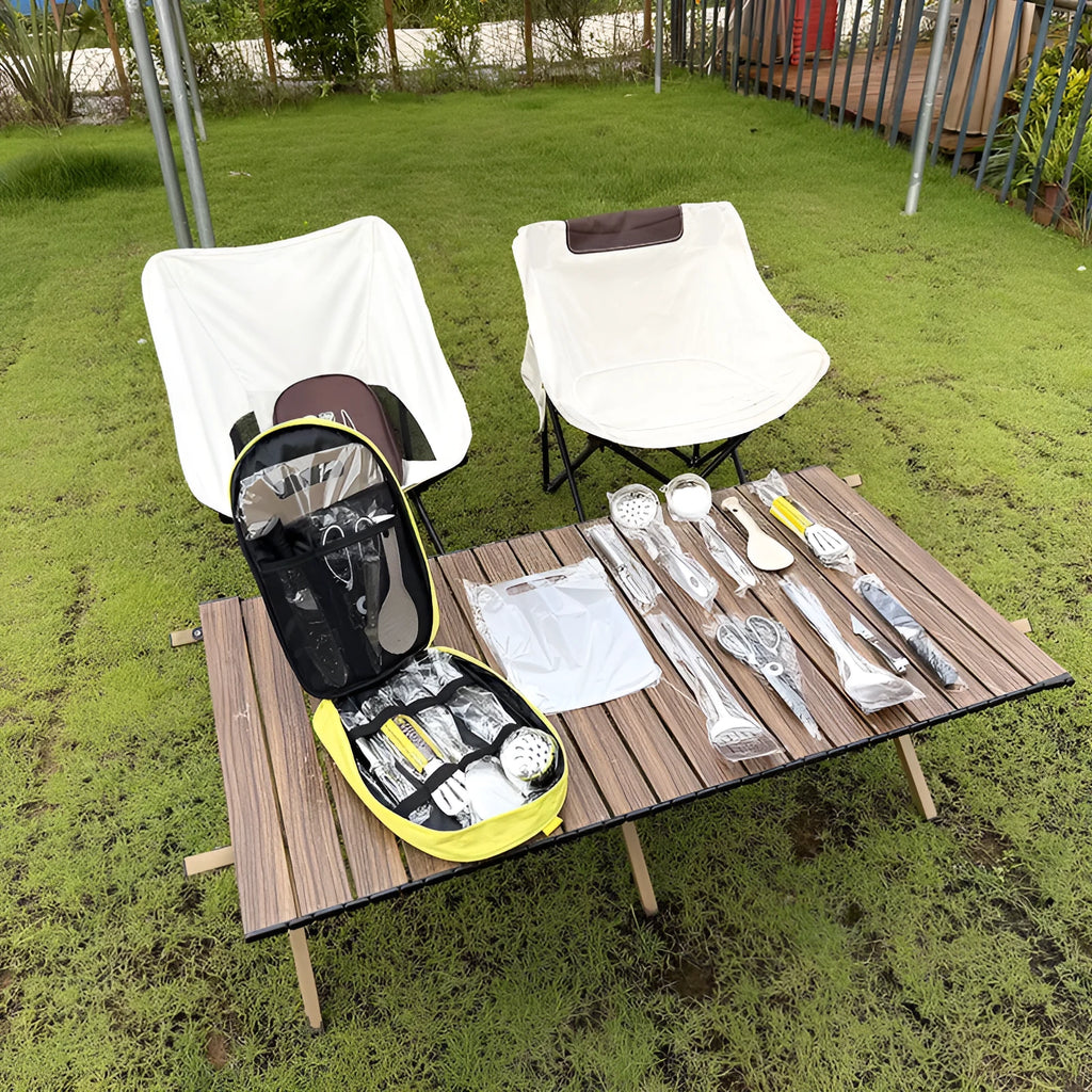 Portable picnic bag containing a 12-piece stainless steel kitchenware set.