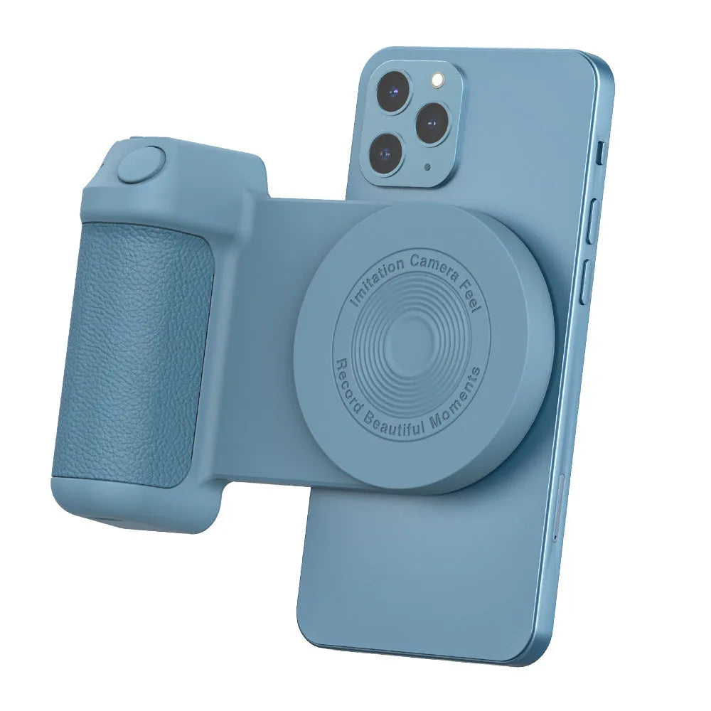 Black 3-in-1 magnetic phone camera holder with ergonomic handle on a wooden table.