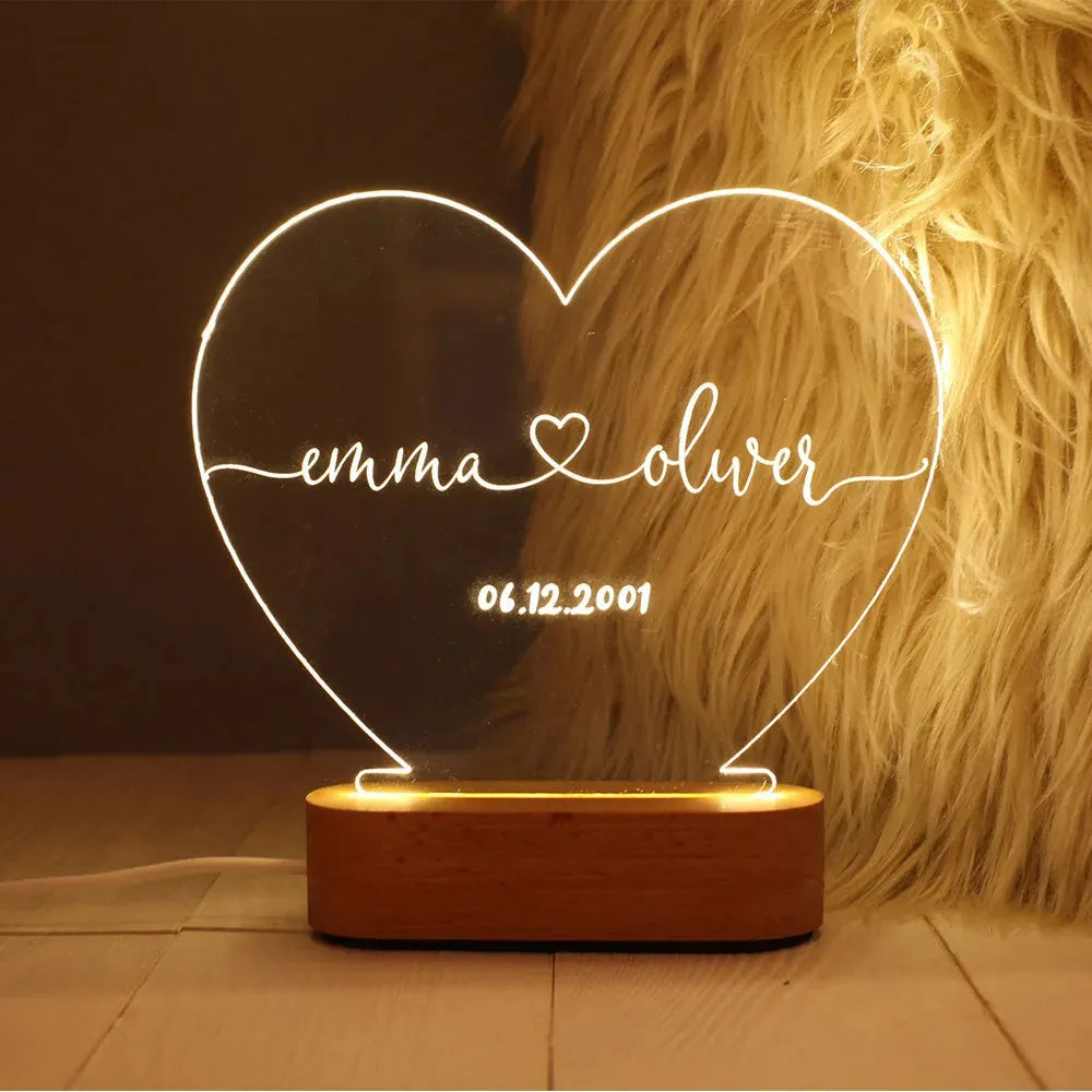 Custom acrylic LED night light with personalised names and dates illuminated