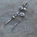 Hesheng geometric antique silver-plated long rhinestone pendant earrings on display
