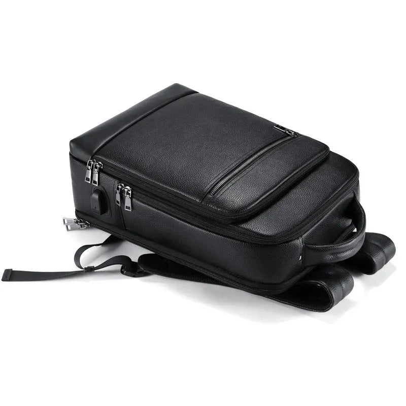 Black genuine cowhide leather men's business backpack with curved shoulder strap.