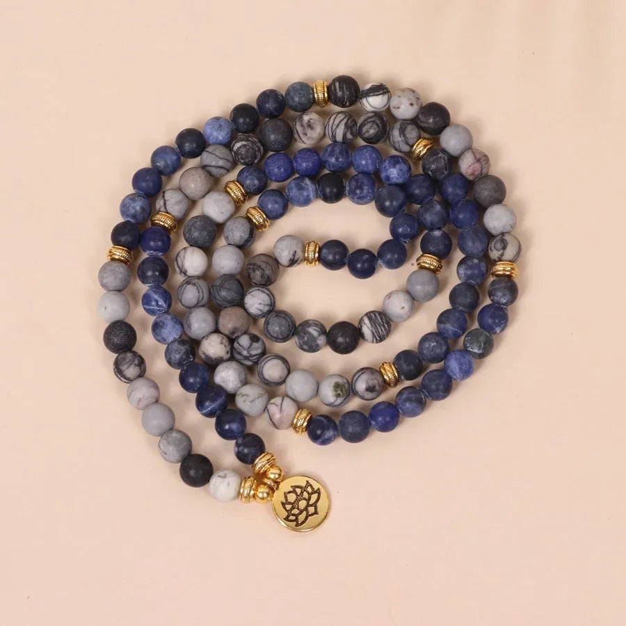 Multi-layer alloy women's bracelet with blue patterned network stone beads.