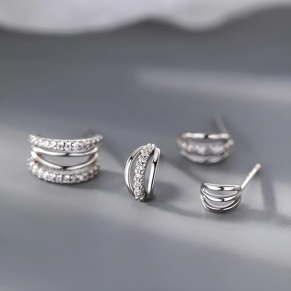 A pair of geometry-shaped 925 silver needle earrings with an electroplated finish, shown in large, medium, and small size options.