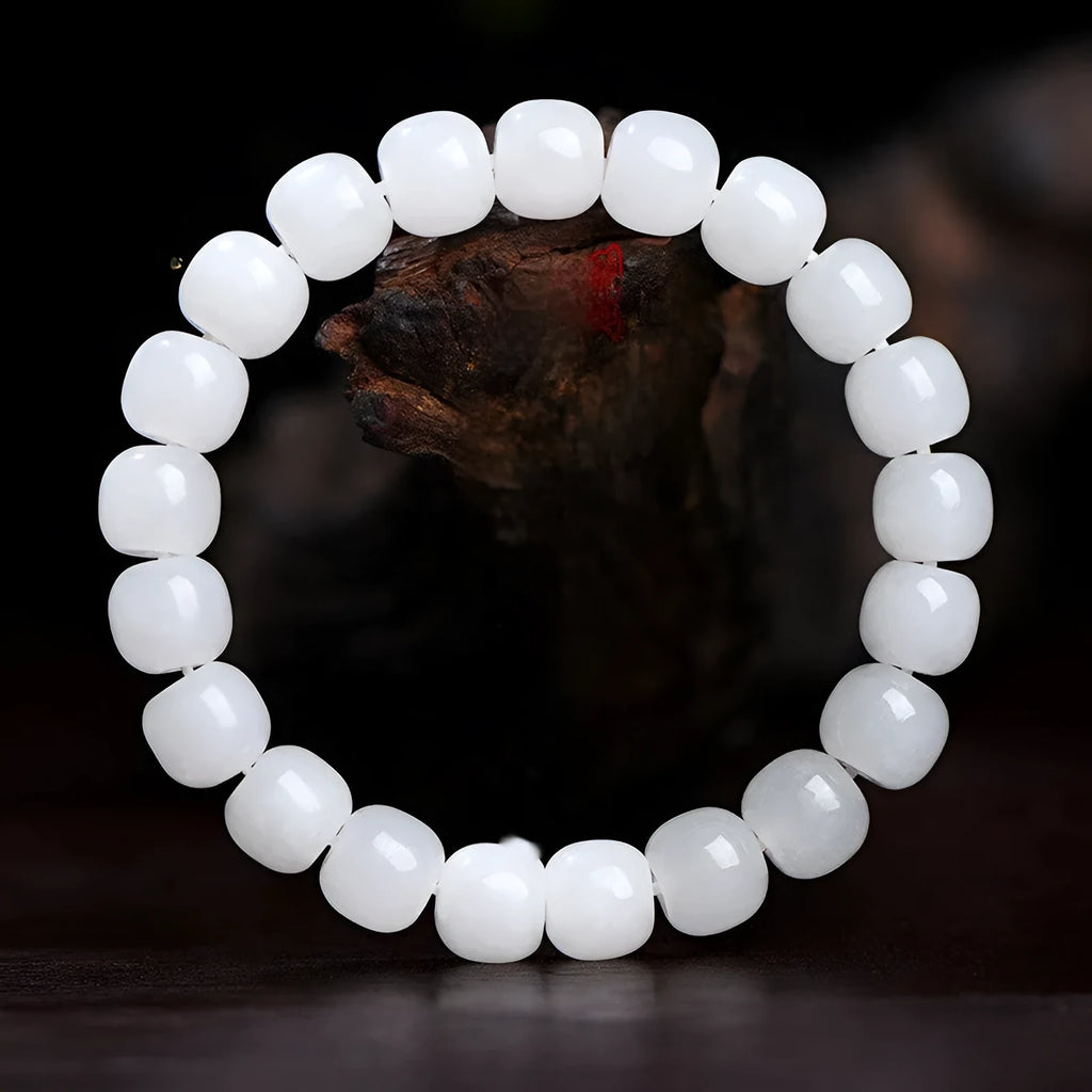White Hetian jade barrel bead bracelet shown on a wrist, showcasing its unisex casual style.
