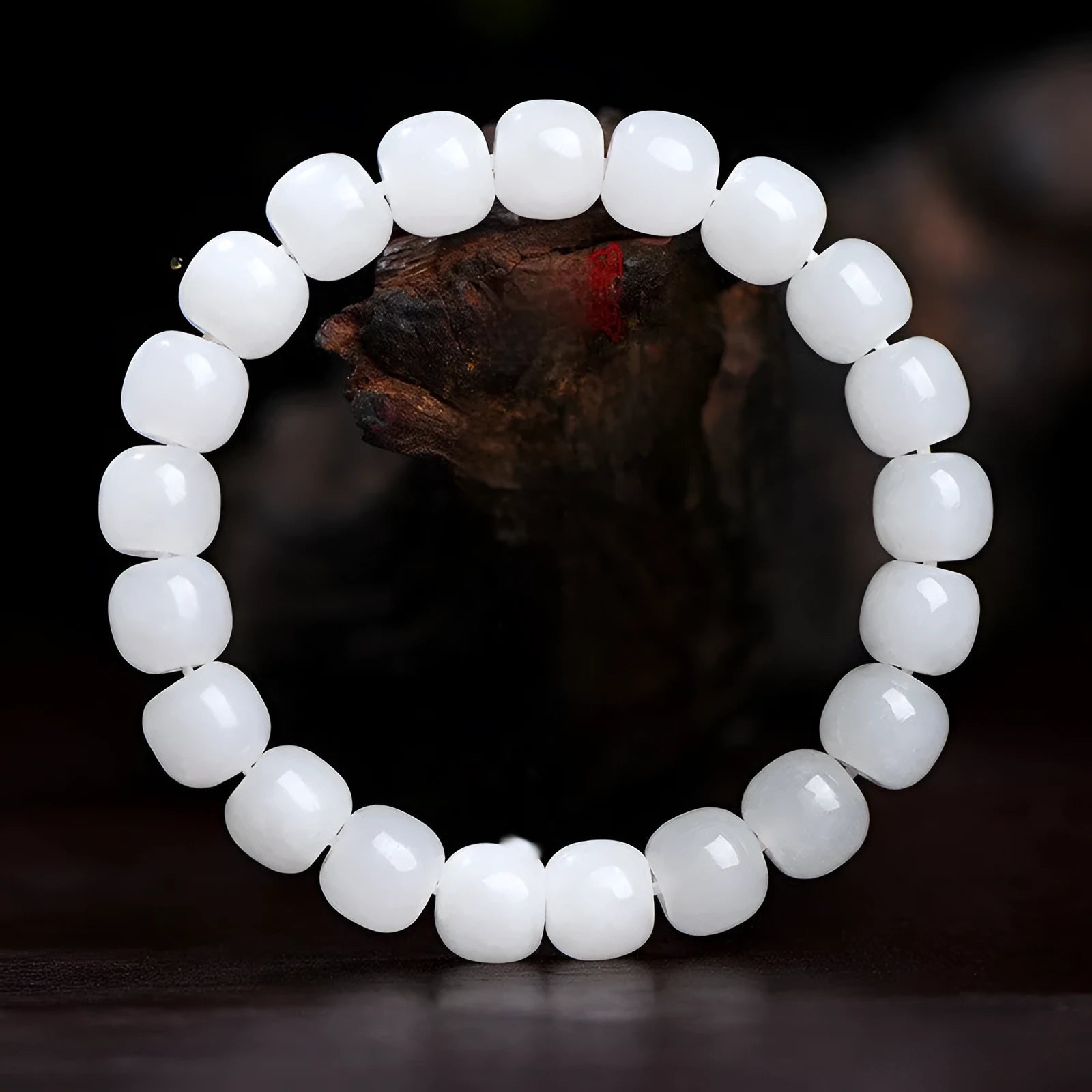 White Hetian jade barrel bead bracelet shown on a wrist, showcasing its unisex casual style.