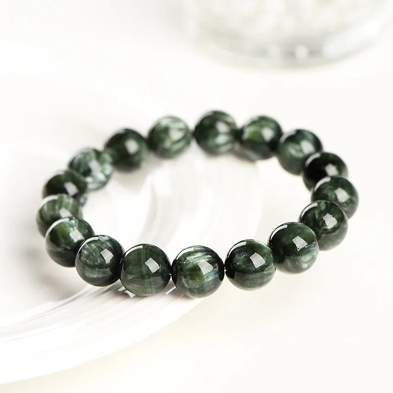 Green Dragon Crystal bracelet with round beads featuring Ruyi element design