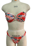 Floral print lace trim bikini top in blue, with matching short, shown on a mannequin.