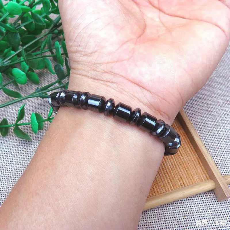 Black pentagram stone magnetic therapy bracelet with a stretch band for men and women.