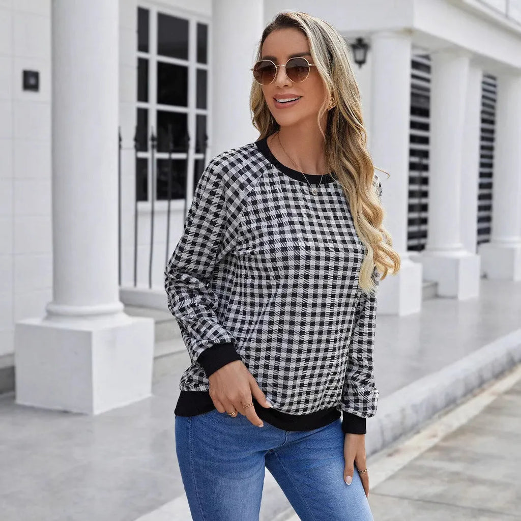 Black polyester pullover sweater with printed plaid pattern and long sleeves