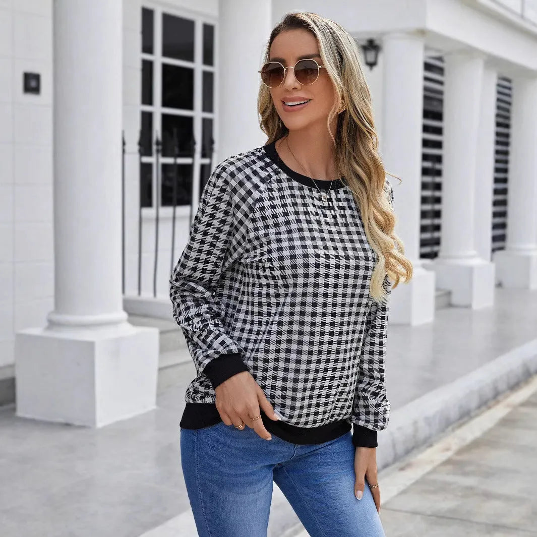 Black polyester pullover sweater with printed plaid pattern and long sleeves
