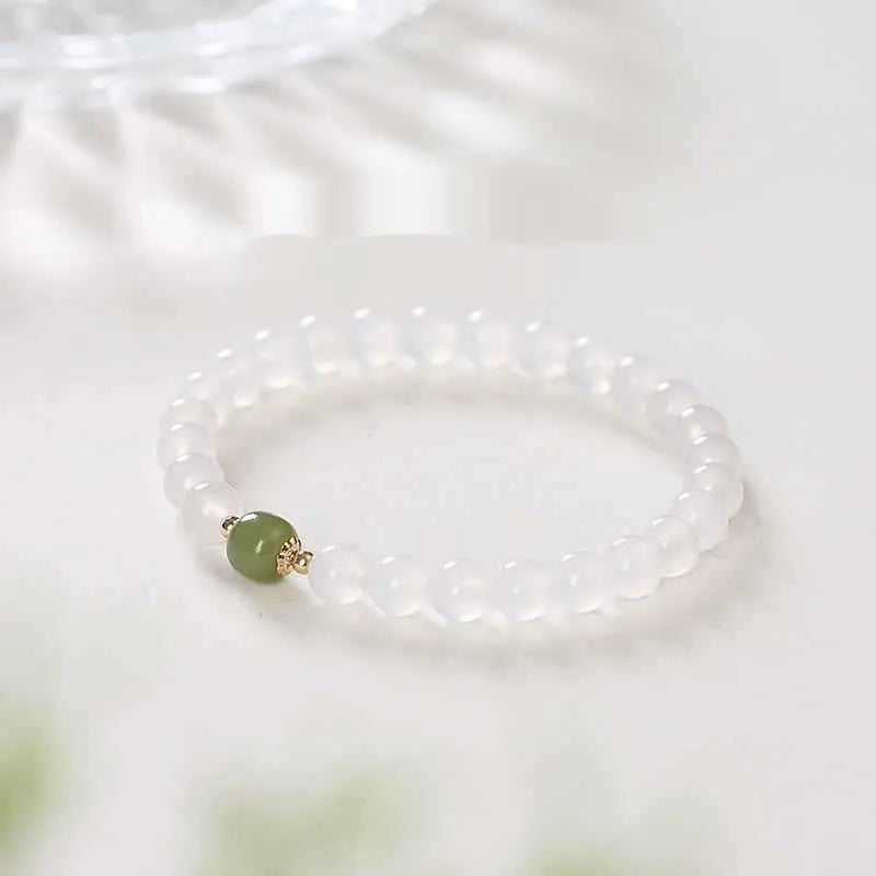 Natural white agate crystal bracelet with cinnabar inlay and text detail, handmade, 6mm and 8mm beads