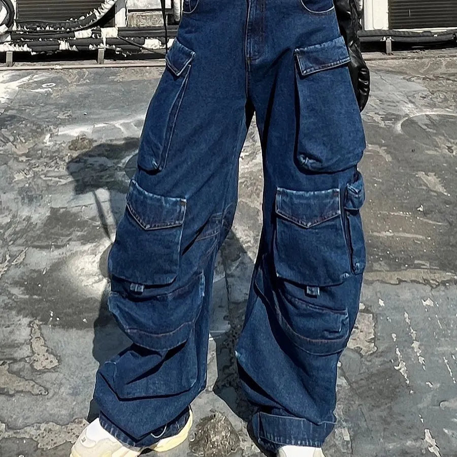 Dark blue distressed wide-leg women's jeans with a high waist and multiple pockets on a hanger.