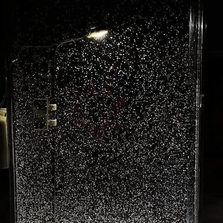 DIY material kit for building a snowy landscape night light with small street lamp and LED effects.