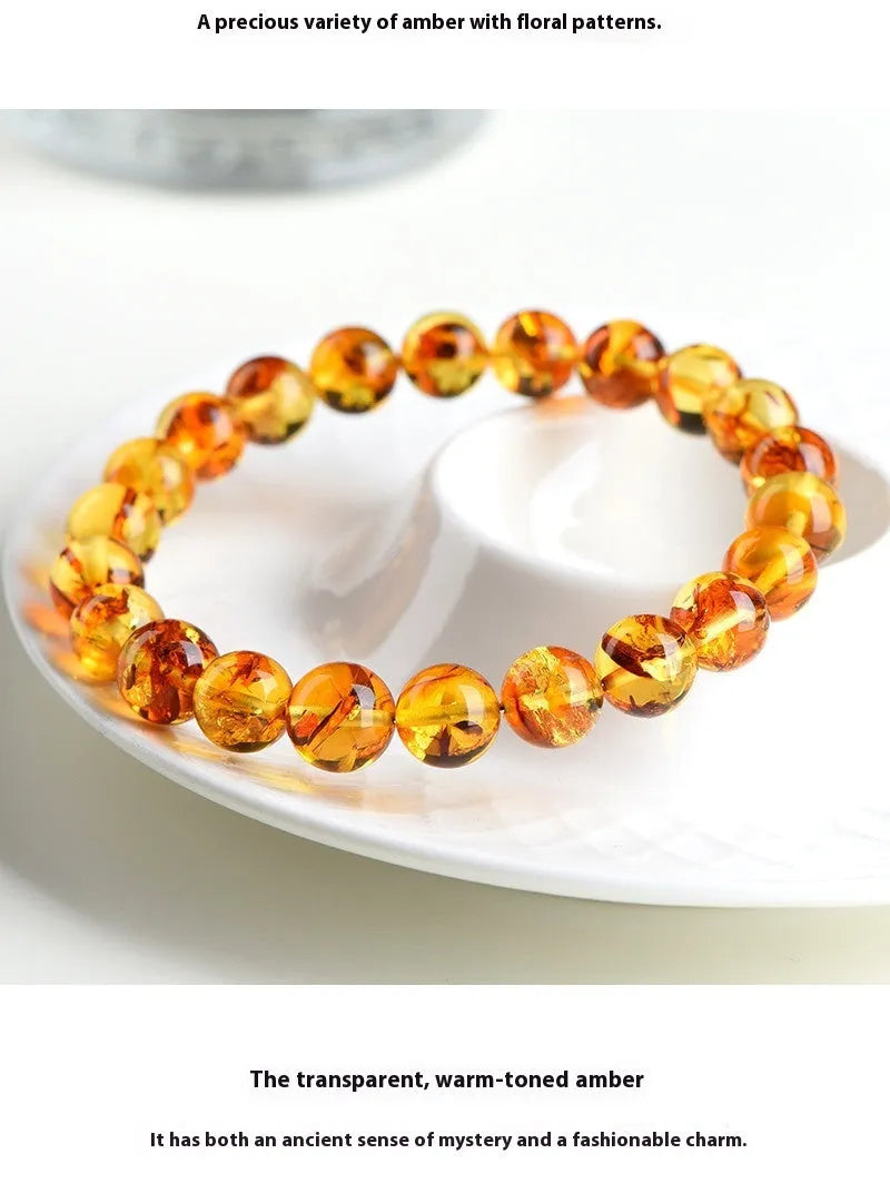 Natural yellow piebald amber bracelet with flower spot patterning and geometry beads