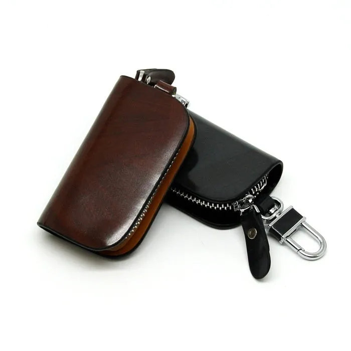 Genuine leather car key case with zipper in black and brown.