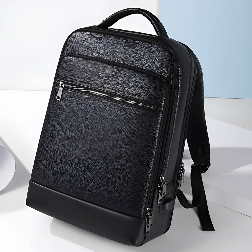 Black genuine cowhide leather men's business backpack with curved shoulder strap.