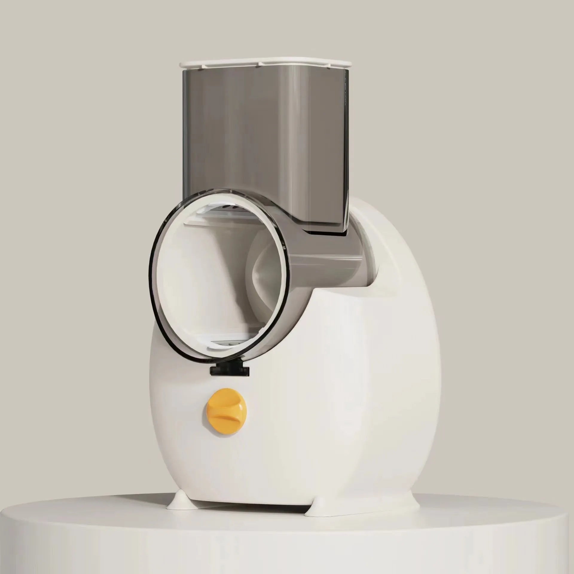 White electric vegetable slicer with rotary blades, suction base, and feeding port on a kitchen counter.