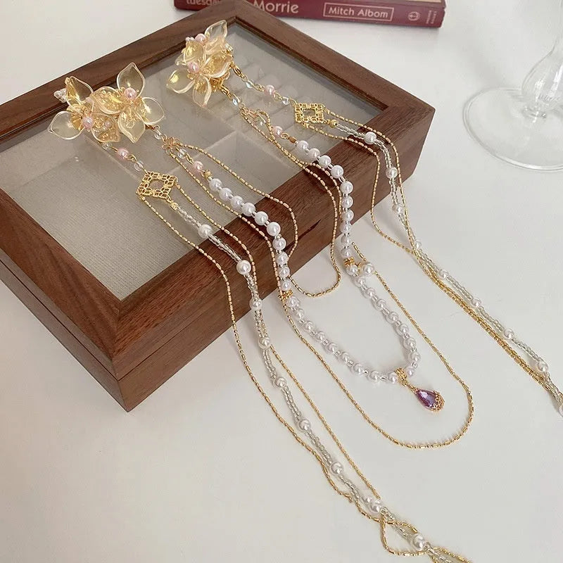 Women's gold grip hairpin with pearl, diamond flower and long tassel design