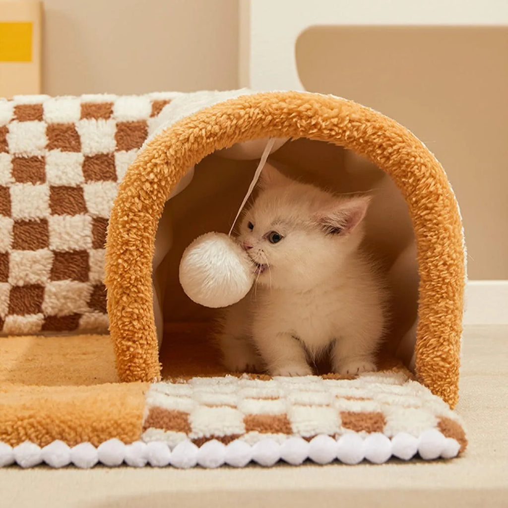 Coffee-coloured plush pet bed with attached tunnel showing soft sleeping area and play space