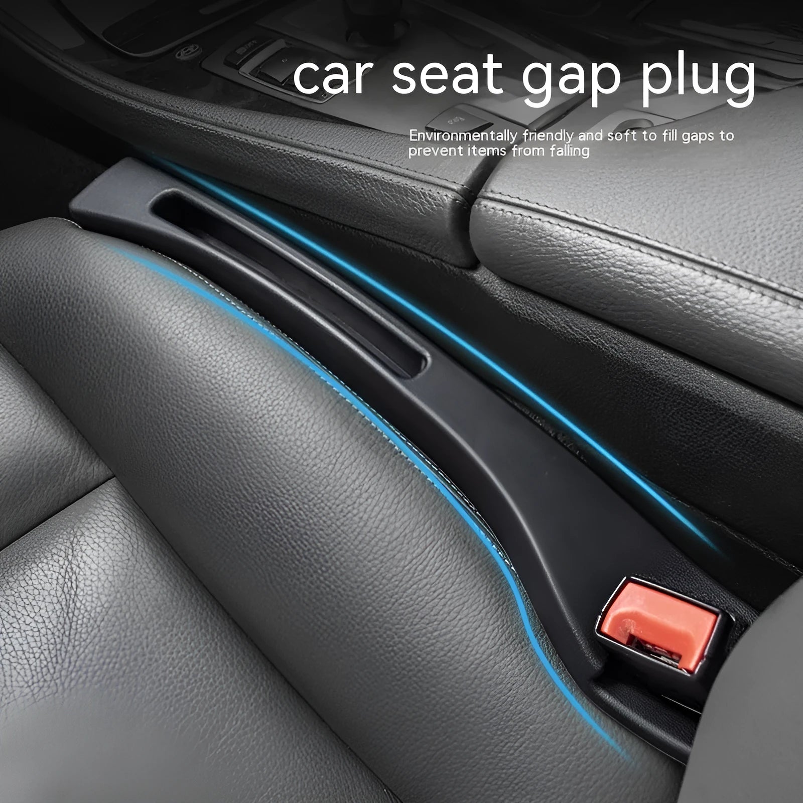 Black plastic car seat gap storage box with handle inserted between vehicle front seats.
