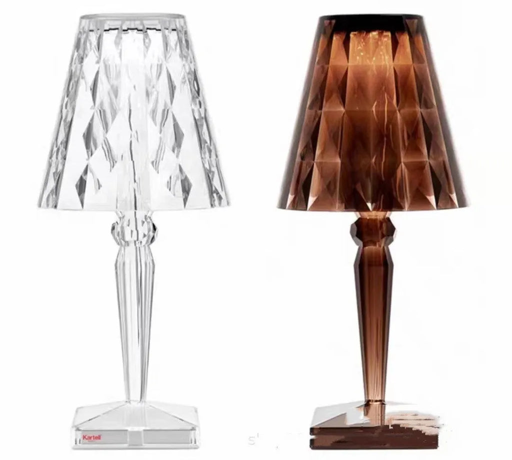 Portable rose gold touch control night light with acrylic lamp holder on a table.