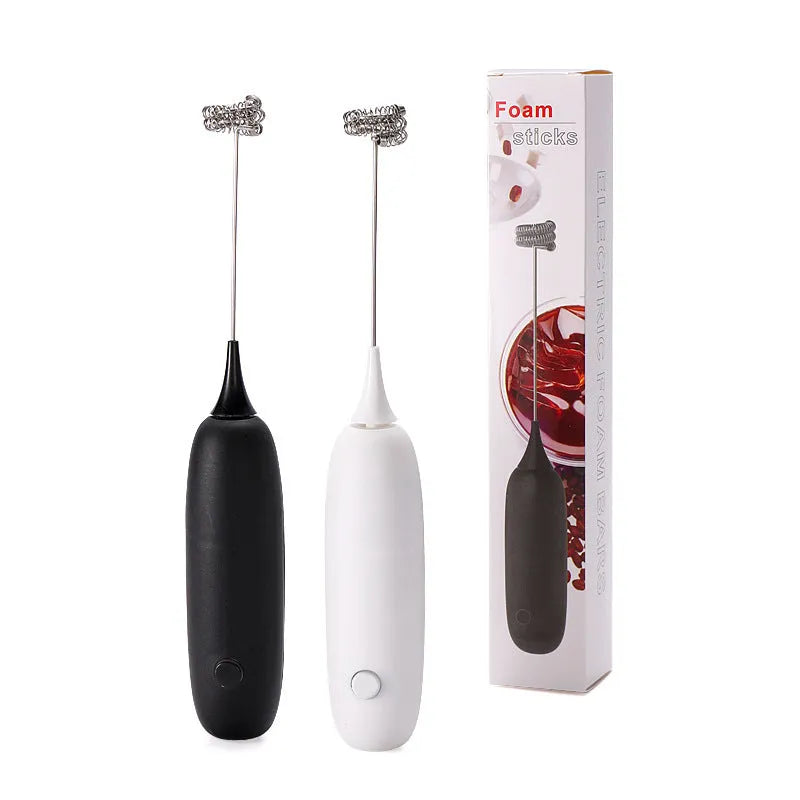 Black and white hand-held electric milk frother blender for coffee beverages