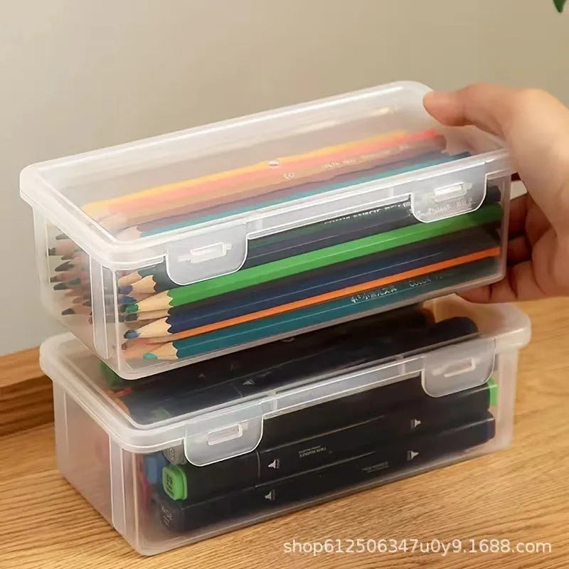 Transparent plastic stationery storage box showing pencils and art supplies inside