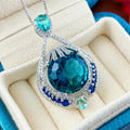 Blue geometric women's necklace with fireworks cut pendant on water wave chain