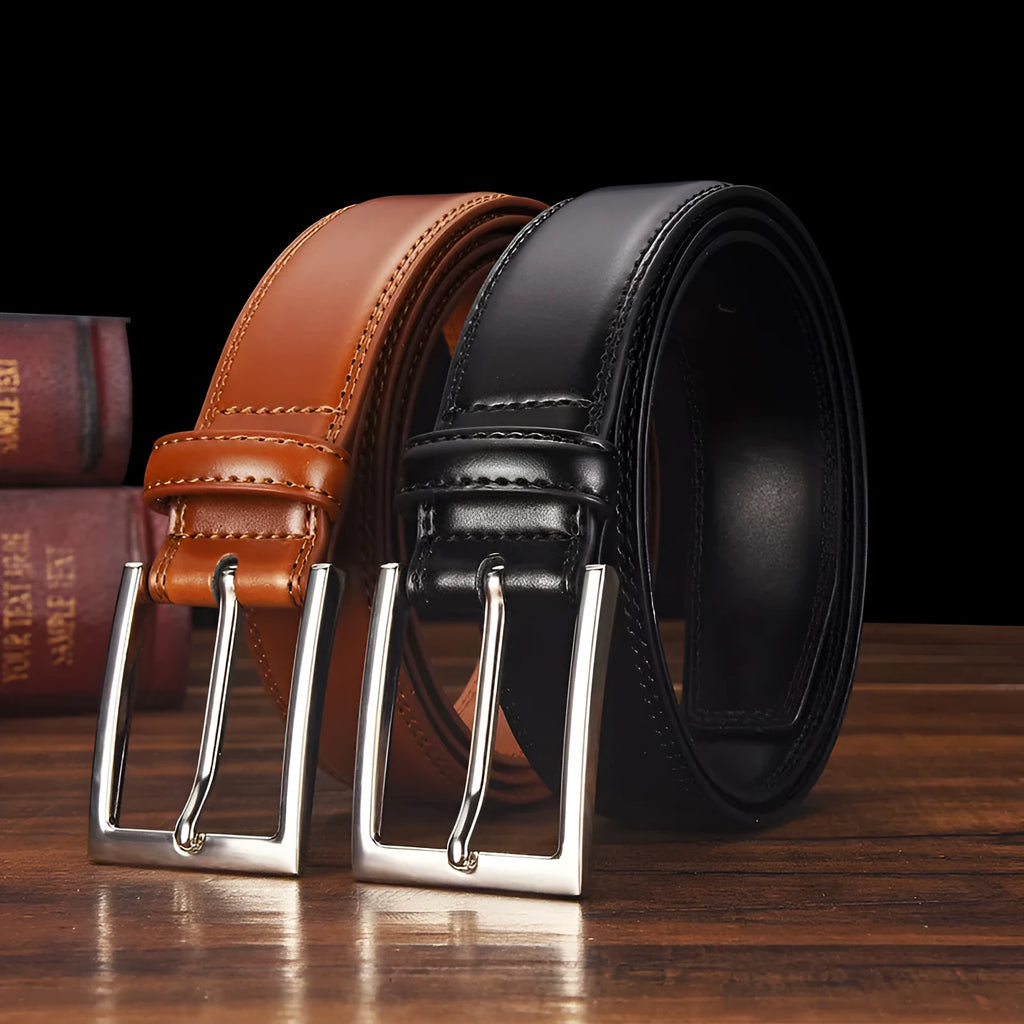 Men's black genuine leather belt with a silver alloy pin buckle on a trouser waistband