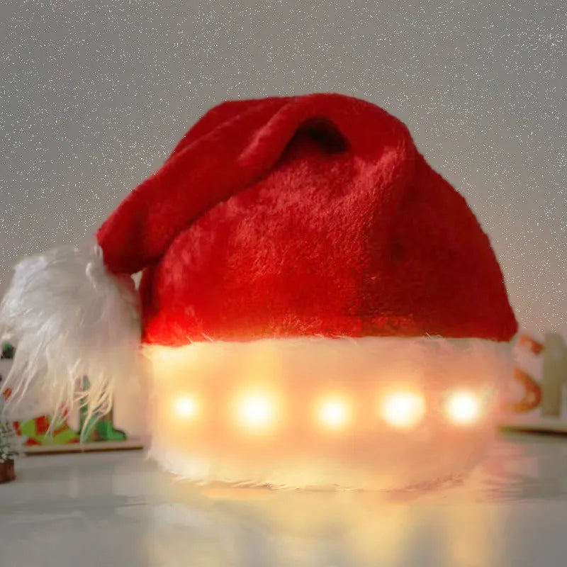 Red and white plush Santa hat with integrated twinkling LED lights and a white pom-pom.