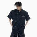 Men's loose fit casual short-sleeved shirt with decorative metal buttons on front
