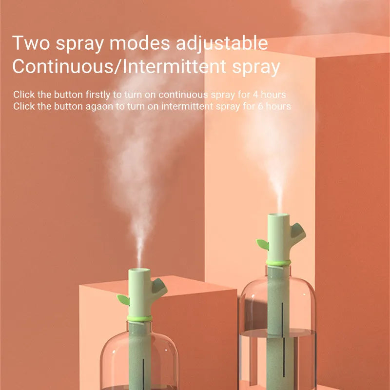 Mini portable USB air humidifier with branch nozzle, transparent plastic, 197mm tall, producing cool mist