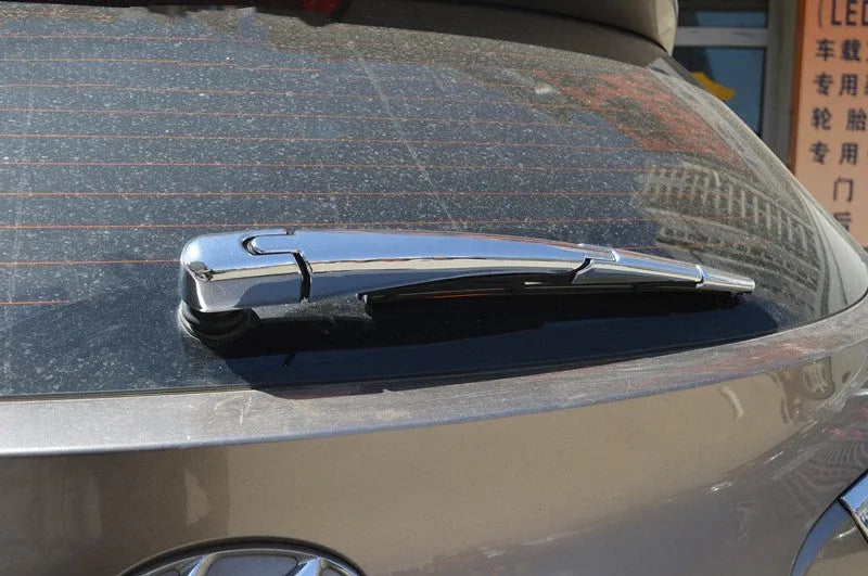 Set of four silvery ABS plastic rear window wiper cover strips for a 2010 Hyundai.